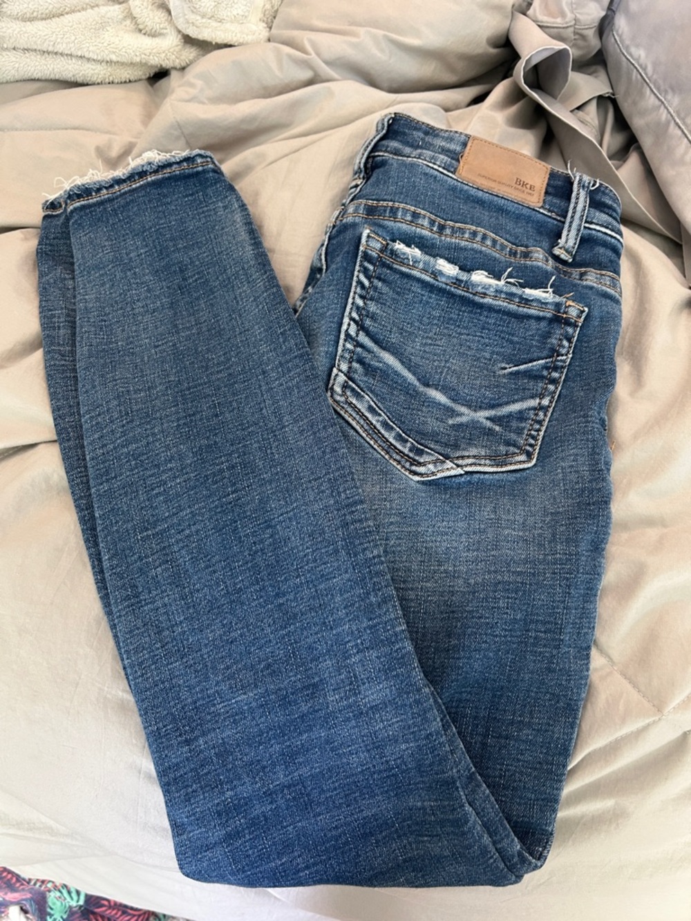 BKE Women's Medium Blue Skinny Jeans with Raw Frayed Hem